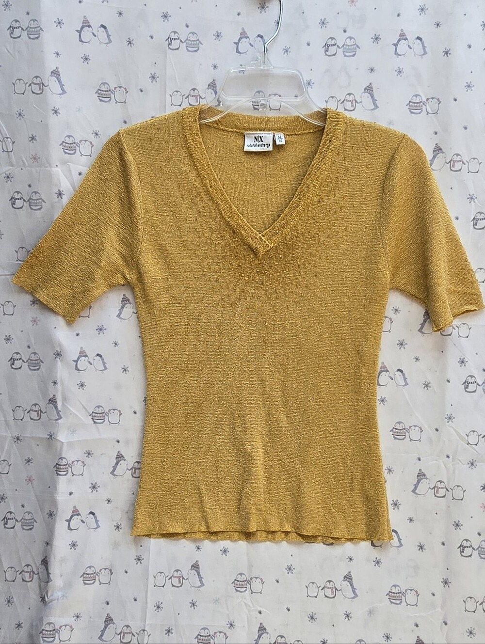 Natural Exchange NX gold metallic knit top with a V-neckline. Size M